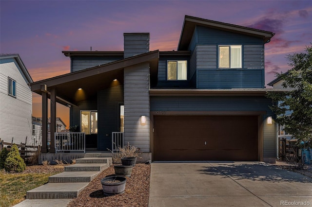 10796 Truckee Cir, Commerce City, CO 80022 - contemporary house with covered porch, driveway, a garage, and a chimney