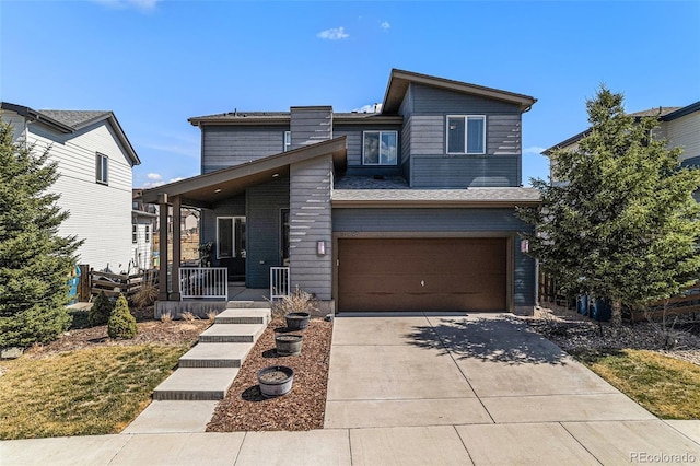 10796 Truckee Cir, Commerce City, CO 80022 - contemporary house featuring a porch, a garage, and driveway