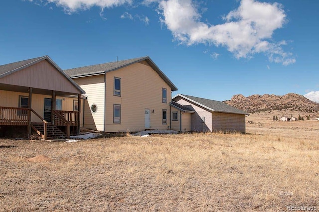 back of house featuring a mountain view