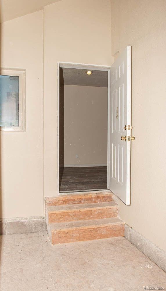 stairway featuring vaulted ceiling