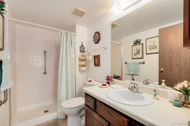 13902 E Marina Dr Unit 303, Aurora, CO 80014 - bathroom featuring toilet, a tile shower, and vanity