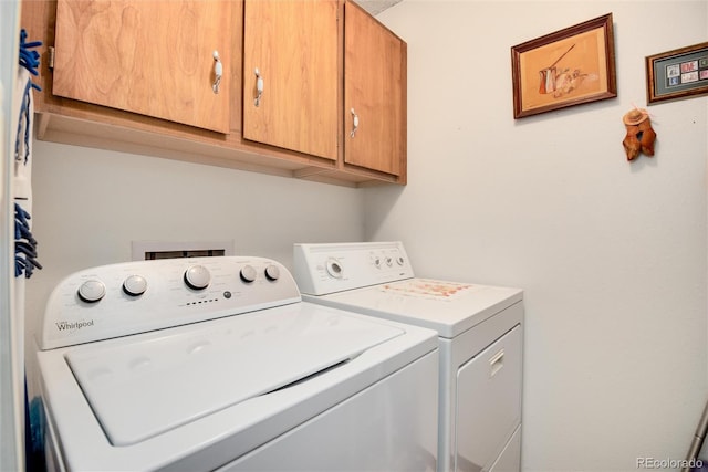 13902 E Marina Dr Unit 303, Aurora, CO 80014 - washroom featuring cabinet space and washing machine and clothes dryer