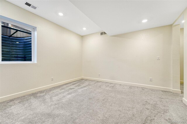 unfurnished room with light carpet