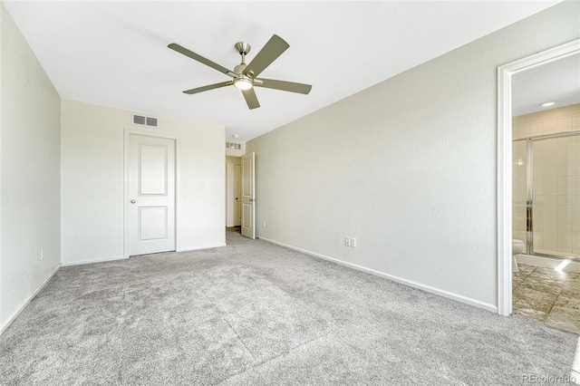 unfurnished bedroom with carpet flooring, ensuite bath, and ceiling fan