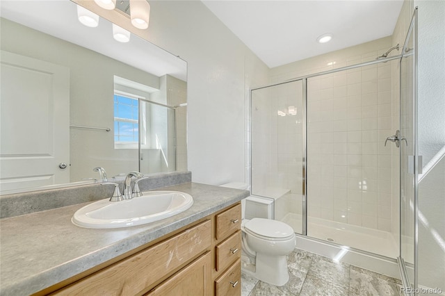 bathroom with tile patterned flooring, walk in shower, toilet, and vanity