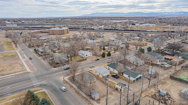 birds eye view of property featuring a mountain view