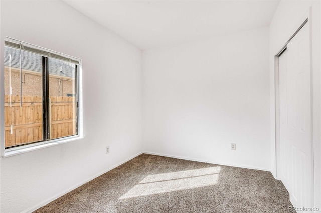 unfurnished room with carpet