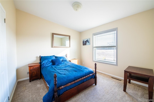 bedroom featuring light colored carpet