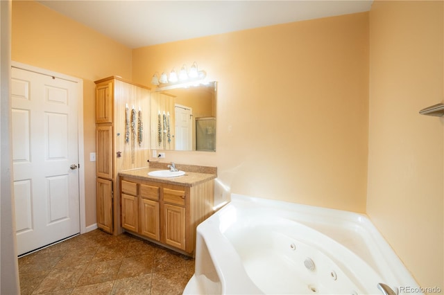 bathroom with a tub and vanity