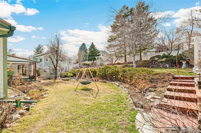 view of yard featuring a residential view and fence