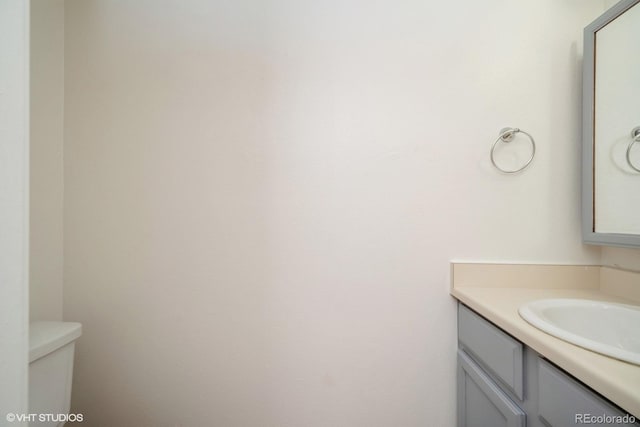 bathroom with vanity and toilet