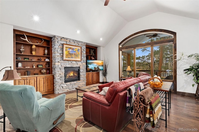 1524 Fox Acres Dr Unit 412, Red Feather Lakes, CO 80545 - living area featuring a ceiling fan, a fireplace, lofted ceiling, wood-type flooring, and built in features