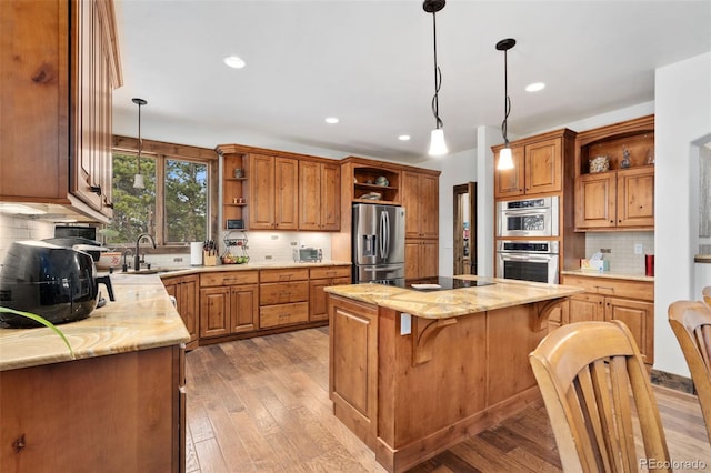 1524 Fox Acres Dr Unit 412, Red Feather Lakes, CO 80545 - kitchen featuring open shelves, appliances with stainless steel finishes, backsplash, a kitchen island, and hanging light fixtures