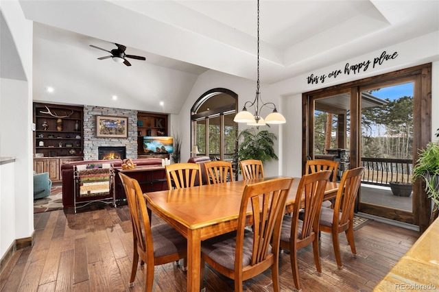 1524 Fox Acres Dr Unit 412, Red Feather Lakes, CO 80545 - dining space with healthy amount of natural light, dark wood-type flooring, a ceiling fan, a stone fireplace, and recessed lighting