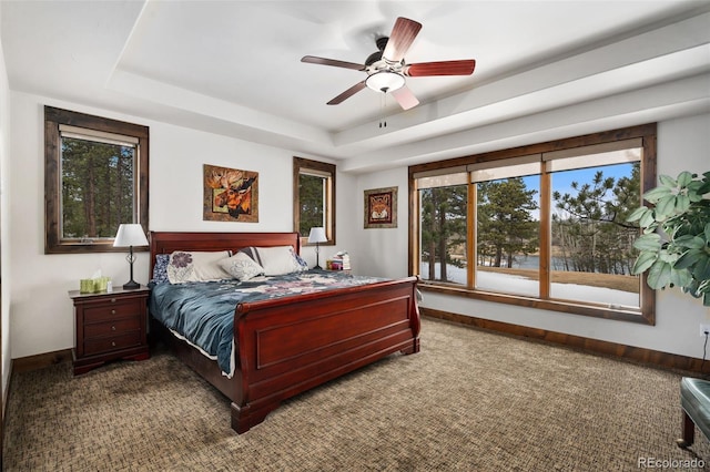 1524 Fox Acres Dr Unit 412, Red Feather Lakes, CO 80545 - bedroom featuring multiple windows, a raised ceiling, and carpet floors