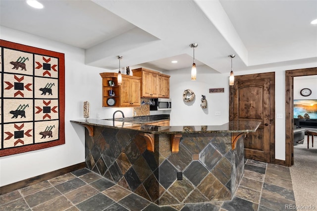1524 Fox Acres Dr Unit 412, Red Feather Lakes, CO 80545 - kitchen with stainless steel microwave, a breakfast bar area, open shelves, dark stone finish floors, and recessed lighting