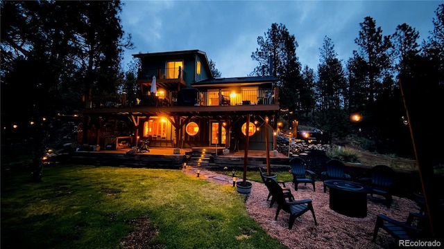 16626 Ouray Rd W, Pine, CO 80470 - back of house featuring an outdoor fire pit, a balcony, a yard, and a patio