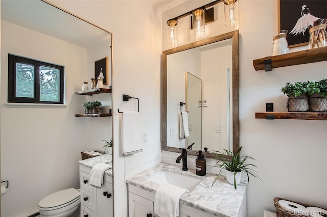 16626 Ouray Rd W, Pine, CO 80470 - bathroom with vanity, toilet, and baseboard heating