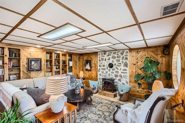 16626 Ouray Rd W, Pine, CO 80470 - living room featuring wooden walls and a wood stove