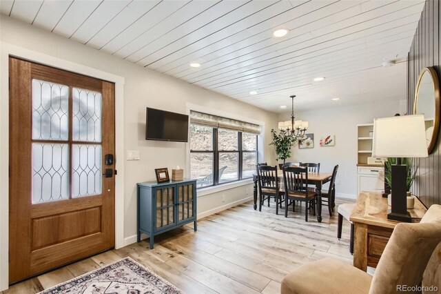 16626 Ouray Rd W, Pine, CO 80470 - living area with a chandelier, light wood-style flooring, recessed lighting, wood ceiling, and baseboards