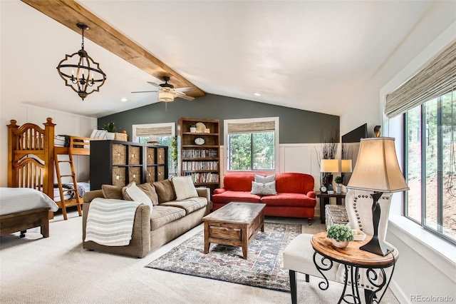 16626 Ouray Rd W, Pine, CO 80470 - carpeted living room featuring plenty of natural light, a ceiling fan, and a chandelier