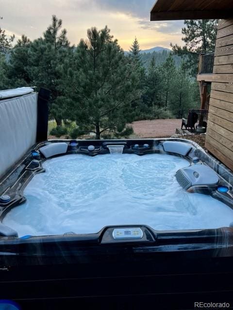 16626 Ouray Rd W, Pine, CO 80470 - view of swimming pool with a hot tub and a view of trees