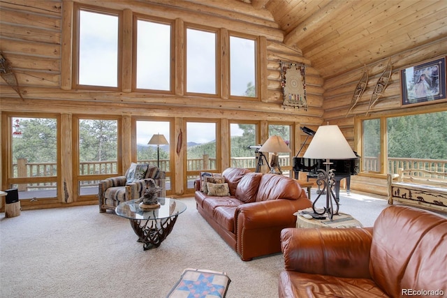 living room with rustic walls, carpet, wooden ceiling, and a high ceiling