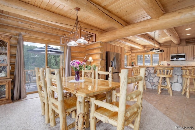 dining area featuring beamed ceiling, light carpet, rustic walls, and wooden ceiling