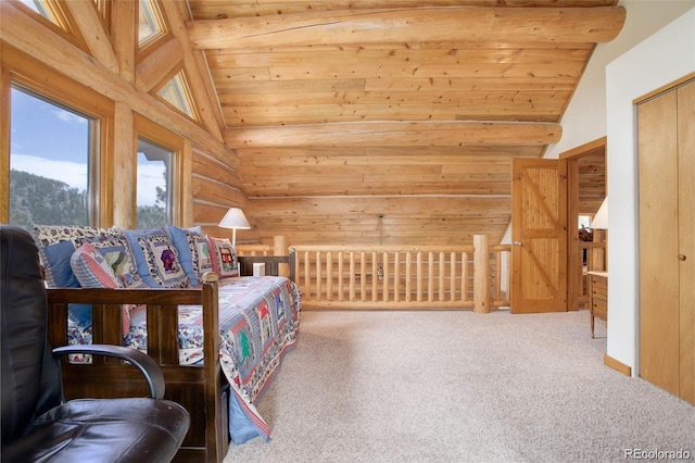 carpeted bedroom featuring a closet and lofted ceiling with beams