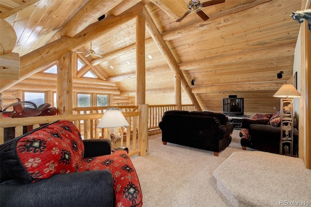 carpeted living room featuring rustic walls, ceiling fan, and wooden ceiling