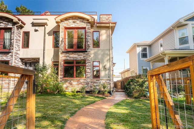 2034 Newton St, Denver, CO 80211 - view of front facade featuring stone siding, stucco siding, and a chimney