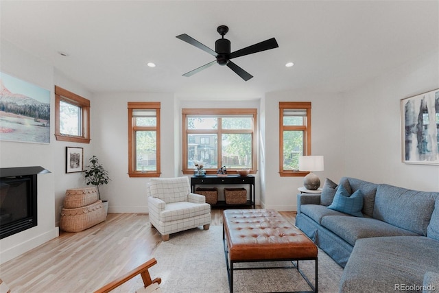2034 Newton St, Denver, CO 80211 - living area featuring wood finished floors, a ceiling fan, recessed lighting, baseboards, and a glass covered fireplace