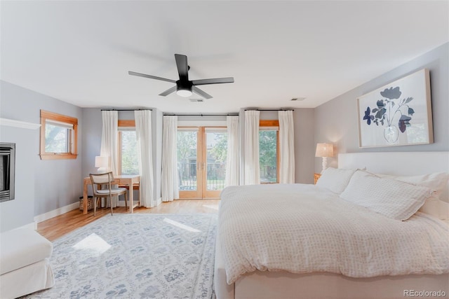 2034 Newton St, Denver, CO 80211 - bedroom featuring access to outside, wood finished floors, baseboards, and ceiling fan