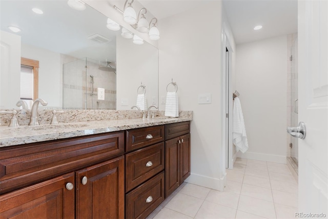 2034 Newton St, Denver, CO 80211 - bathroom featuring double vanity, a stall shower, tile patterned flooring, baseboards, and recessed lighting