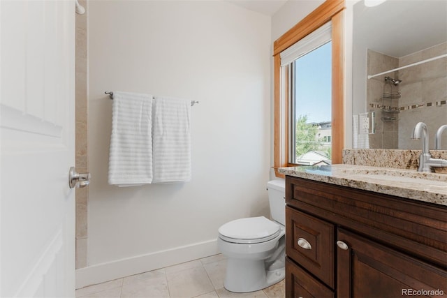 2034 Newton St, Denver, CO 80211 - full bathroom featuring tile patterned flooring, vanity, tiled shower, toilet, and baseboards