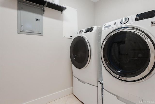 2034 Newton St, Denver, CO 80211 - washroom with electric panel, washer and dryer, baseboards, and light tile patterned flooring
