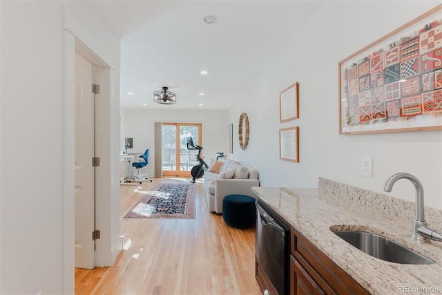2034 Newton St, Denver, CO 80211 - kitchen featuring a sink, light wood-type flooring, dishwasher, light stone countertops, and recessed lighting