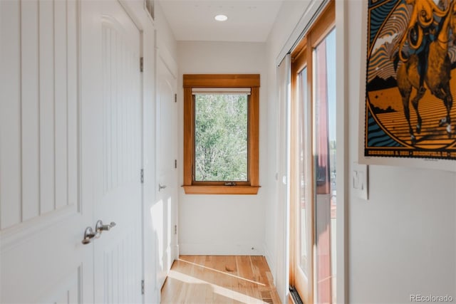 2034 Newton St, Denver, CO 80211 - hallway featuring light wood finished floors and baseboards