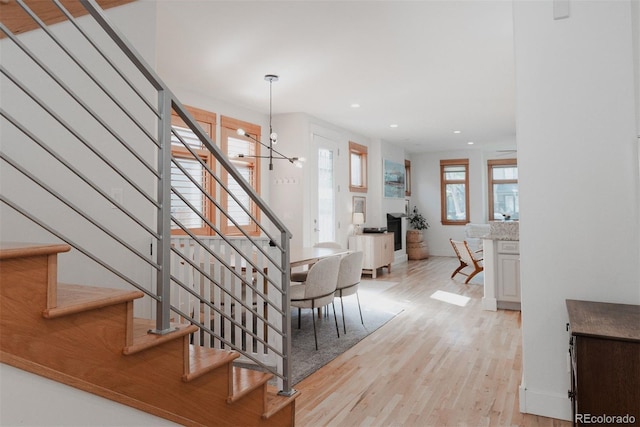 2034 Newton St, Denver, CO 80211 - stairs featuring wood finished floors and recessed lighting