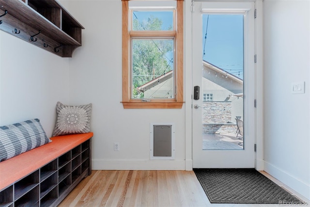 2034 Newton St, Denver, CO 80211 - mudroom featuring wood finished floors, baseboards, and heating unit