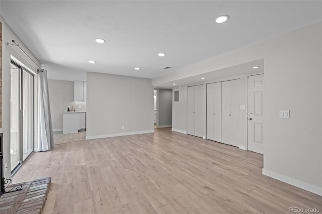 unfurnished living room featuring light hardwood / wood-style flooring