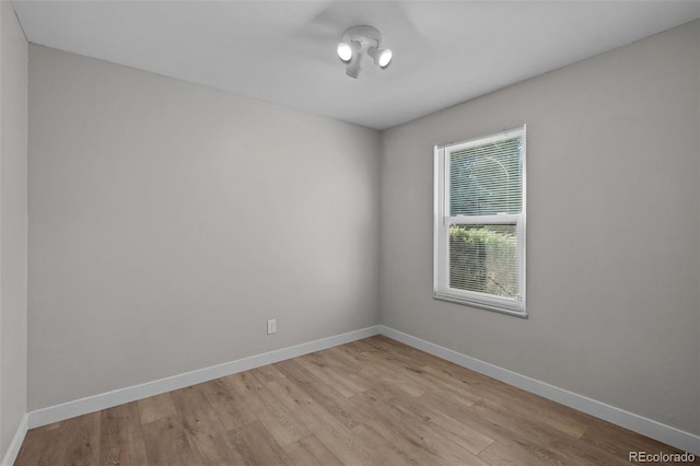 spare room with light hardwood / wood-style flooring