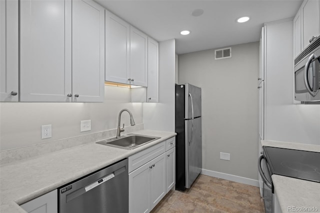 kitchen with white cabinets, sink, and stainless steel appliances