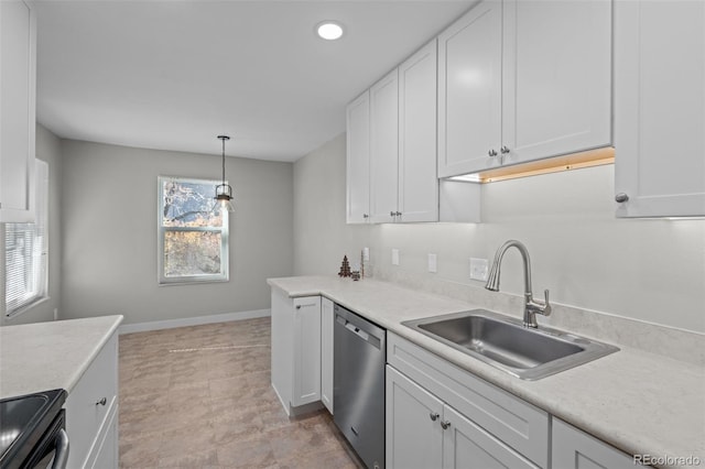 kitchen featuring stainless steel dishwasher, sink, decorative light fixtures, white cabinetry, and black / electric stove