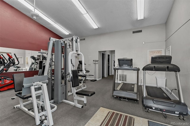 workout area with a textured ceiling