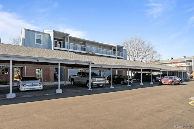 view of parking / parking lot featuring a carport