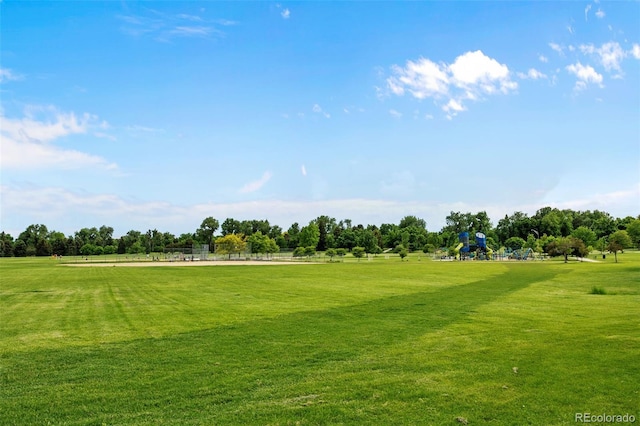 view of property's community featuring a yard