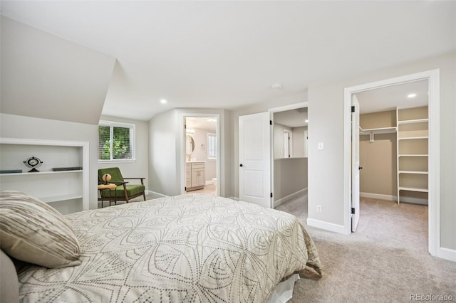 2880 S High St, Denver, CO 80210 - bedroom featuring a walk in closet, carpet floors, connected bathroom, and recessed lighting
