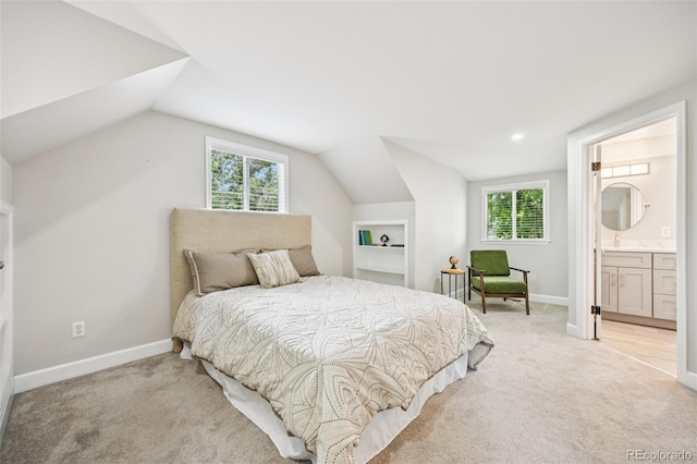 2880 S High St, Denver, CO 80210 - bedroom featuring lofted ceiling, light colored carpet, multiple windows, and ensuite bathroom