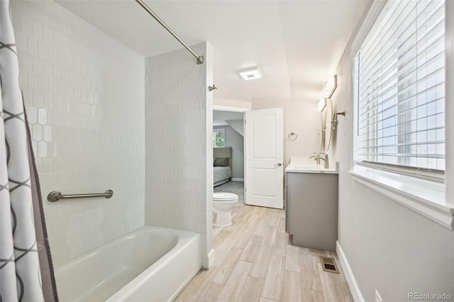 2880 S High St, Denver, CO 80210 - bathroom featuring shower / bathtub combination with curtain, vanity, and wood finished floors